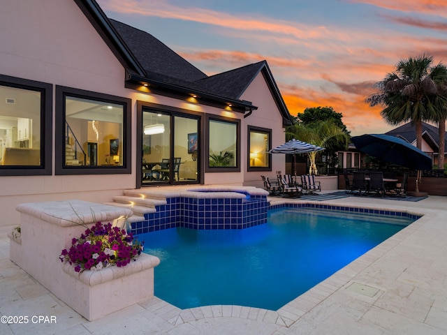 1507 Trout Ln, Panama City Beach, FL 32408 - view of swimming pool featuring a patio, outdoor dining space, and a pool with connected hot tub