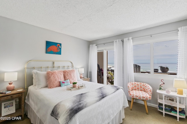 23223 Front Beach Rd Unit A704, Panama City Beach, FL 32413 - carpeted bedroom featuring a textured ceiling