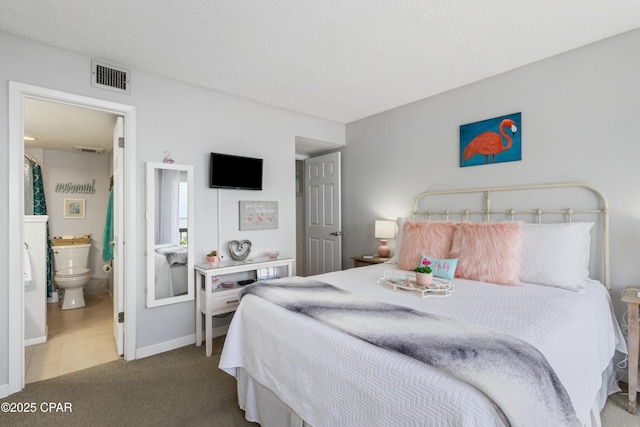 23223 Front Beach Rd Unit A704, Panama City Beach, FL 32413 - carpeted bedroom with baseboards and ensuite bath