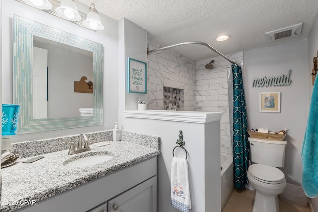 23223 Front Beach Rd Unit A704, Panama City Beach, FL 32413 - full bath featuring vanity, a textured ceiling, toilet, shower / bath combo with shower curtain, and tile patterned floors