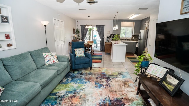 2808 Garrison Ave, Port St Joe, FL 32456 - living area with a ceiling fan and light tile patterned flooring