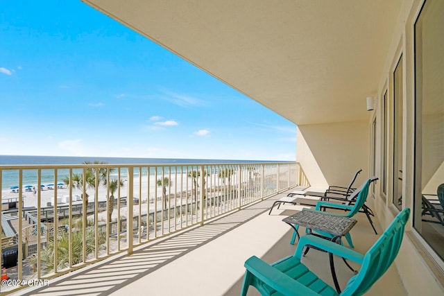 8715 Surf Dr Unit 304B, Panama City, FL 32408 - balcony featuring view of water and beach