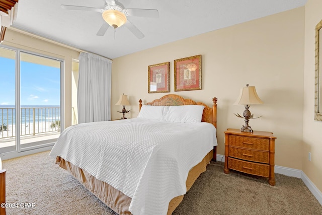 8715 Surf Dr Unit 304B, Panama City, FL 32408 - carpeted bedroom featuring access to exterior, a water view, and ceiling fan