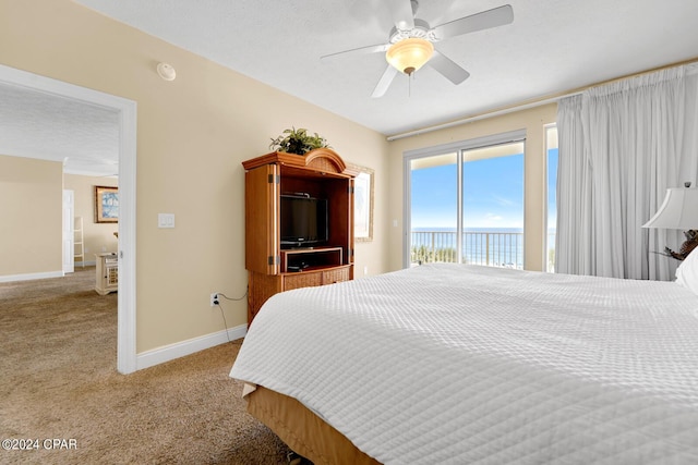 8715 Surf Dr Unit 304B, Panama City, FL 32408 - carpeted bedroom featuring access to exterior and ceiling fan