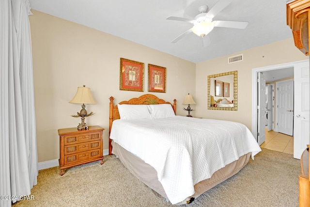 8715 Surf Dr Unit 304B, Panama City, FL 32408 - carpeted bedroom featuring a ceiling fan and tile patterned flooring