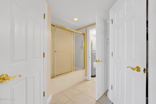 8715 Surf Dr Unit 304B, Panama City, FL 32408 - bathroom with combined bath / shower with glass door and tile patterned floors