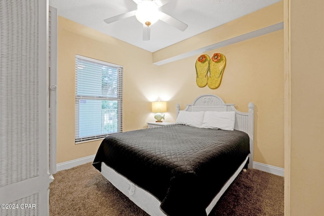 8715 Surf Dr Unit 304B, Panama City, FL 32408 - carpeted bedroom with ceiling fan and baseboards