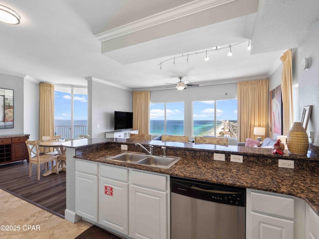 16819 Front Beach Rd Unit 2800, Panama City Beach, FL 32413 - kitchen featuring dishwasher, a sink, open floor plan, crown molding, and white cabinetry