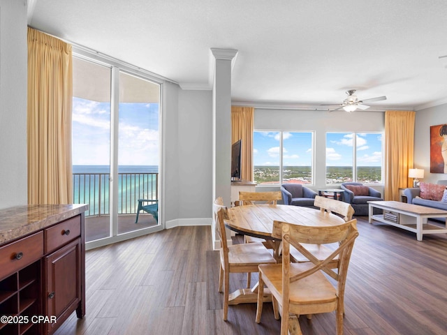 16819 Front Beach Rd Unit 2800, Panama City Beach, FL 32413 - dining space featuring ornamental molding, dark wood finished floors, and a ceiling fan