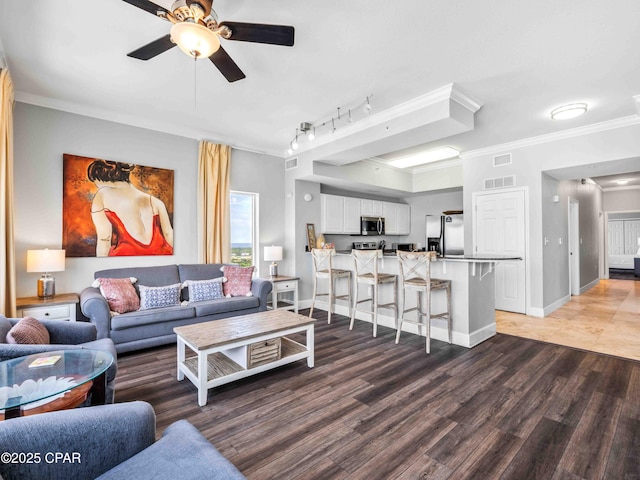 16819 Front Beach Rd Unit 2800, Panama City Beach, FL 32413 - living room with ornamental molding, ceiling fan, light wood finished floors, baseboards, and track lighting