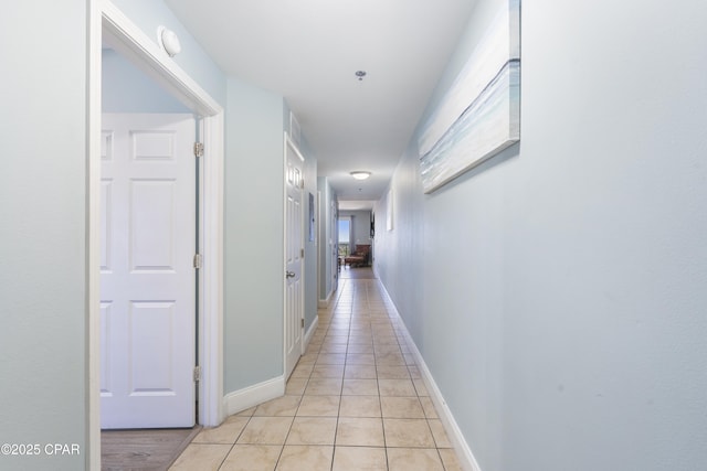 9902 Thomas Dr Unit 1735, Panama City Beach, FL 32407 - hallway featuring light tile patterned floors and baseboards