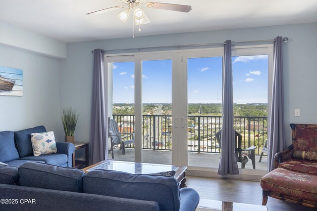 9902 Thomas Dr Unit 1735, Panama City Beach, FL 32407 - living room featuring healthy amount of natural light, wood finished floors, and a ceiling fan