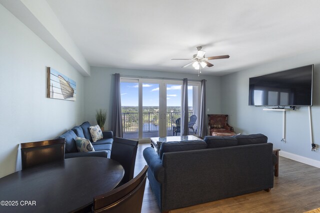 9902 Thomas Dr Unit 1735, Panama City Beach, FL 32407 - living area with ceiling fan, dark wood-style floors, and baseboards