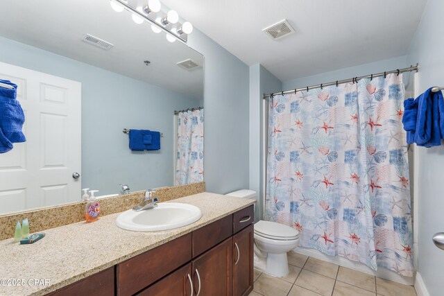 9902 Thomas Dr Unit 1735, Panama City Beach, FL 32407 - bathroom with vanity, tile patterned flooring, toilet, and a shower with curtain