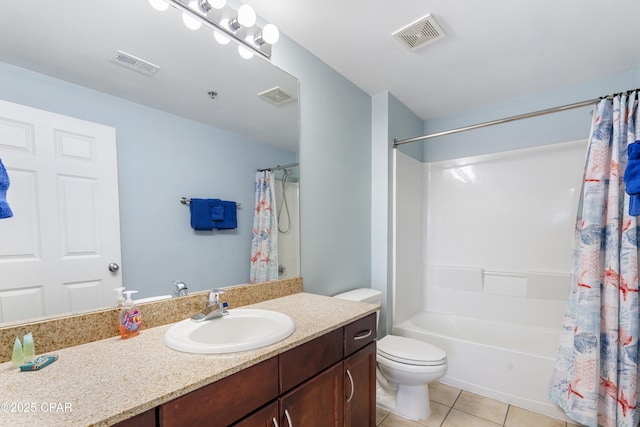 9902 Thomas Dr Unit 1735, Panama City Beach, FL 32407 - full bath featuring tile patterned flooring, vanity, shower / tub combo, and toilet