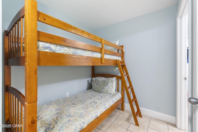 9902 Thomas Dr Unit 1735, Panama City Beach, FL 32407 - bedroom with baseboards and tile patterned floors