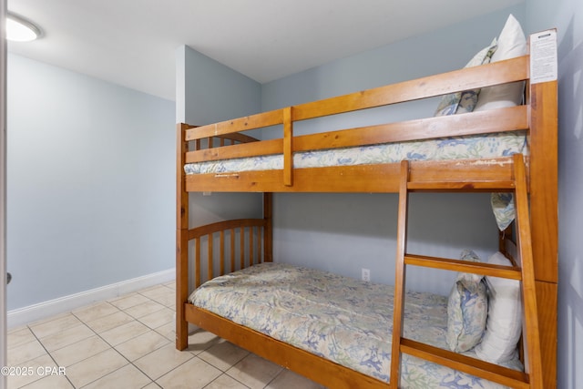 9902 Thomas Dr Unit 1735, Panama City Beach, FL 32407 - bedroom with tile patterned floors and baseboards