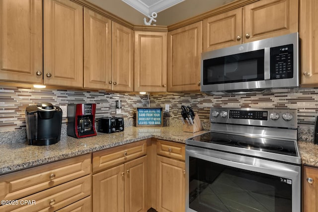 10519 Front Beach Rd Unit 601A, Panama City Beach, FL 32407 - kitchen featuring stainless steel appliances, backsplash, light stone countertops, and crown molding