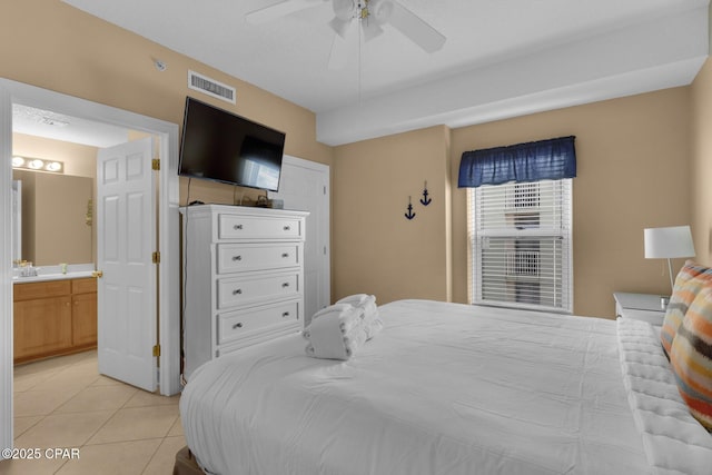 10519 Front Beach Rd Unit 601A, Panama City Beach, FL 32407 - bedroom featuring light tile patterned floors, ensuite bathroom, and a ceiling fan