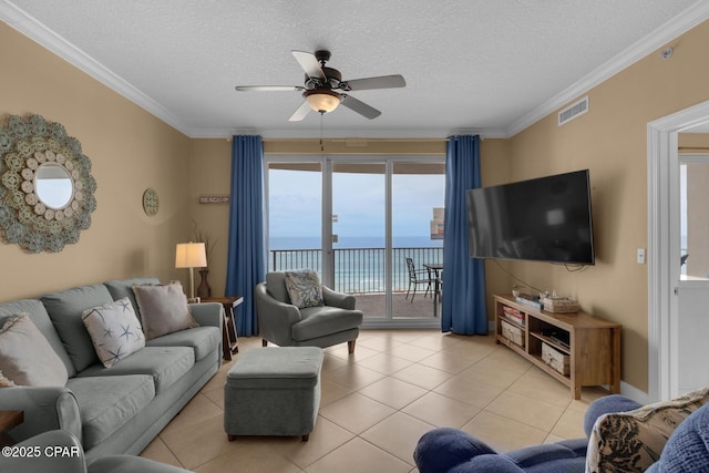 10519 Front Beach Rd Unit 601A, Panama City Beach, FL 32407 - living area with ceiling fan, light tile patterned floors, a textured ceiling, and crown molding
