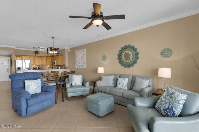 10519 Front Beach Rd Unit 601A, Panama City Beach, FL 32407 - living area with ornamental molding, light tile patterned floors, ceiling fan, and a textured ceiling