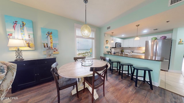 11800 Front Beach Rd Unit 2-201, Panama City Beach, FL 32407 - dining space featuring wood finished floors, baseboards, and recessed lighting