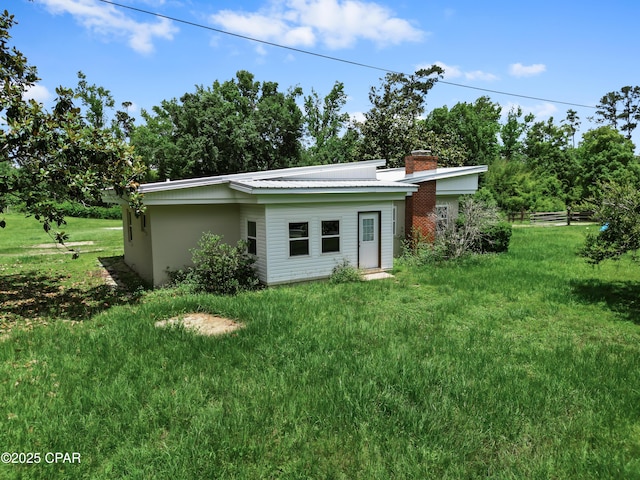 133 Devane Rd, Chattahoochee, FL 32324 - back of property with a yard and a chimney