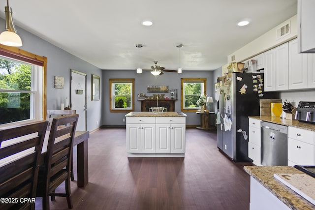 133 Devane Rd, Chattahoochee, FL 32324 - kitchen featuring appliances with stainless steel finishes, a center island, a ceiling fan, healthy amount of natural light, and recessed lighting