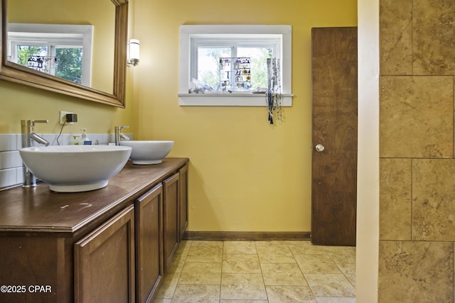 133 Devane Rd, Chattahoochee, FL 32324 - bathroom featuring double vanity, plenty of natural light, and baseboards