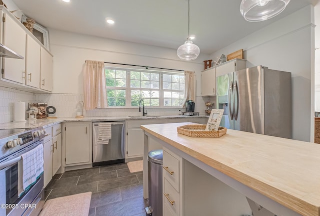 5138 8th Ave, Malone, FL 32445 - kitchen with appliances with stainless steel finishes, a sink, recessed lighting, butcher block counters, and backsplash