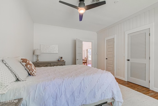 5138 8th Ave, Malone, FL 32445 - bedroom with wood finished floors, baseboards, and ceiling fan
