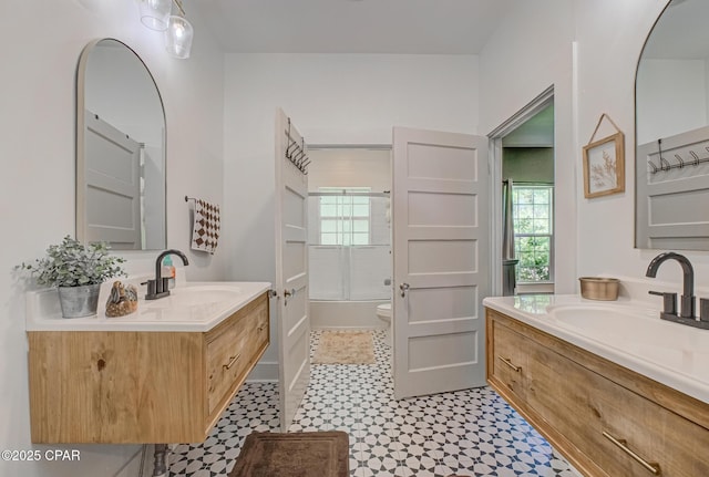 5138 8th Ave, Malone, FL 32445 - full bath with tile patterned floors, two vanities, plenty of natural light, and toilet