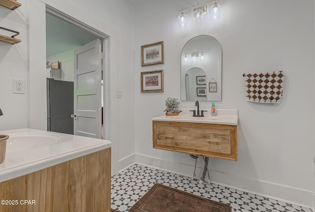 5138 8th Ave, Malone, FL 32445 - bathroom featuring tile patterned floors, baseboards, and a sink