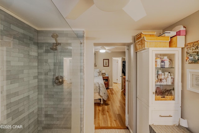 5821 S Lagoon Dr, Panama City, FL 32408 - ensuite bathroom featuring tiled shower and a ceiling fan
