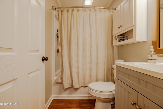 5821 S Lagoon Dr, Panama City, FL 32408 - full bath featuring vanity, toilet, wood finished floors, shower / tub combo, and baseboards