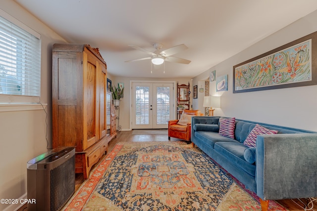 5821 S Lagoon Dr, Panama City, FL 32408 - living area featuring french doors, a ceiling fan, and light wood-style flooring