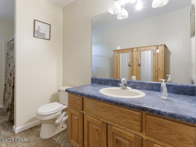 2921 Ambus Ln, Chipley, FL 32428 - full bathroom featuring vanity, toilet, and tile patterned flooring