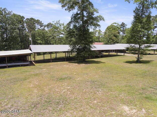 2921 Ambus Ln, Chipley, FL 32428 - view of front facade with a detached carport and a front yard