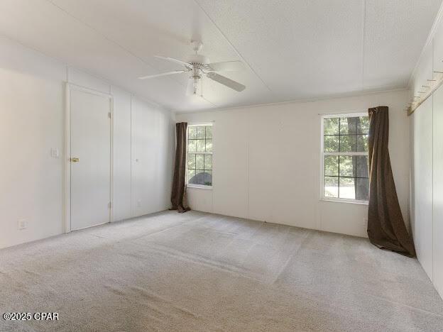 2921 Ambus Ln, Chipley, FL 32428 - carpeted empty room featuring healthy amount of natural light and ceiling fan