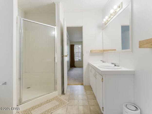 2921 Ambus Ln, Chipley, FL 32428 - bathroom featuring a stall shower and double vanity