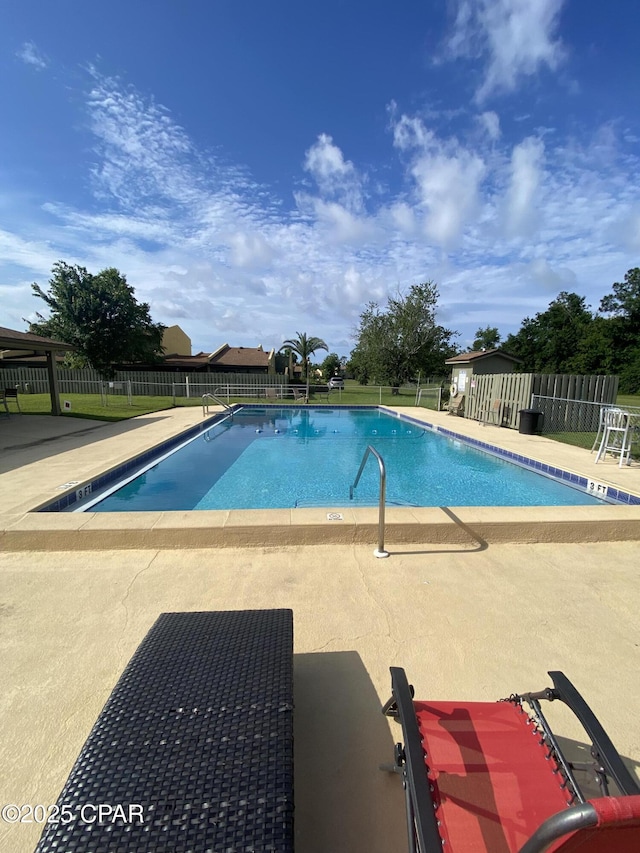 1025 W 19th St Unit 2D, Panama City, FL 32405 - community pool featuring a patio