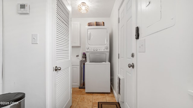 612 Laurel St Unit D, Panama City Beach, FL 32407 - laundry room featuring stacked washer and clothes dryer and cabinet space