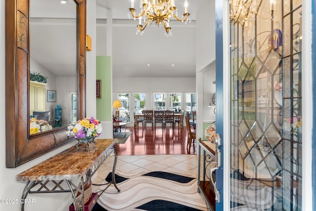 1110 Redfish Cir, Panama City, FL 32408 - entrance foyer with high vaulted ceiling, a chandelier, and tile patterned flooring
