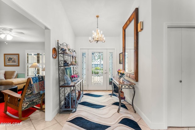 1110 Redfish Cir, Panama City, FL 32408 - foyer entrance with tile patterned floors, a chandelier, ceiling fan, and baseboards
