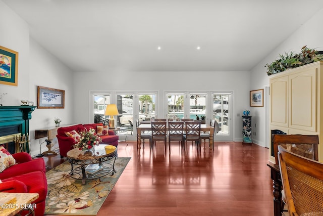 1110 Redfish Cir, Panama City, FL 32408 - living room featuring a glass covered fireplace, wood finished floors, and baseboards