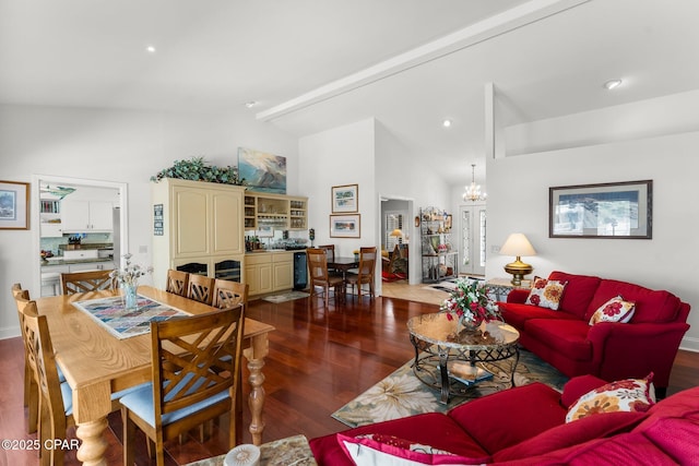 1110 Redfish Cir, Panama City, FL 32408 - living room featuring dark wood-type flooring, high vaulted ceiling, and a chandelier