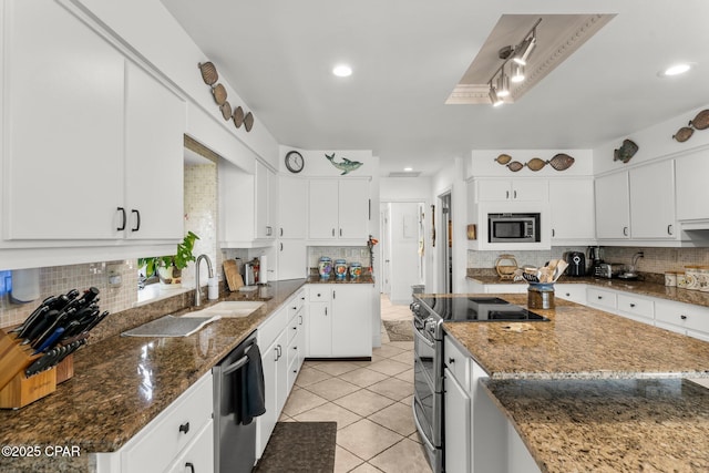 1110 Redfish Cir, Panama City, FL 32408 - kitchen with appliances with stainless steel finishes, a sink, tasteful backsplash, light tile patterned floors, and recessed lighting