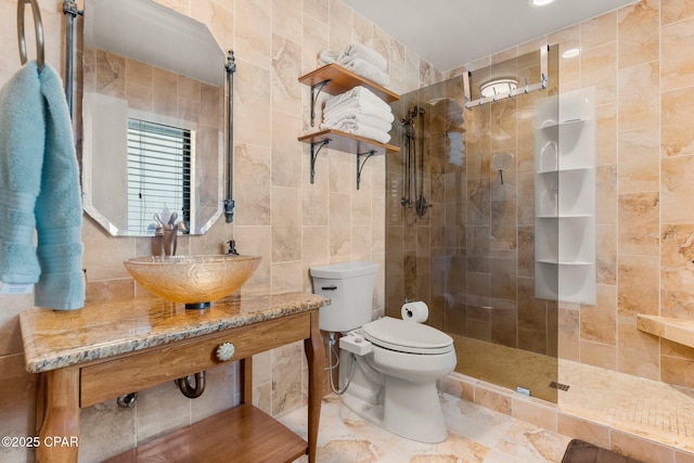 1110 Redfish Cir, Panama City, FL 32408 - bathroom featuring tile walls, a sink, walk in shower, and toilet