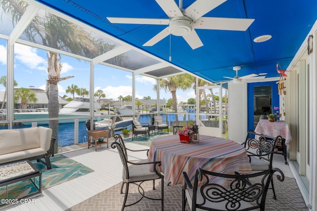 1110 Redfish Cir, Panama City, FL 32408 - sunroom / solarium featuring ceiling fan, plenty of natural light, and a water view