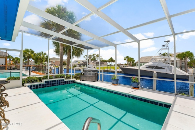 1110 Redfish Cir, Panama City, FL 32408 - swimming pool featuring a water view, a patio, a lanai, and a dock